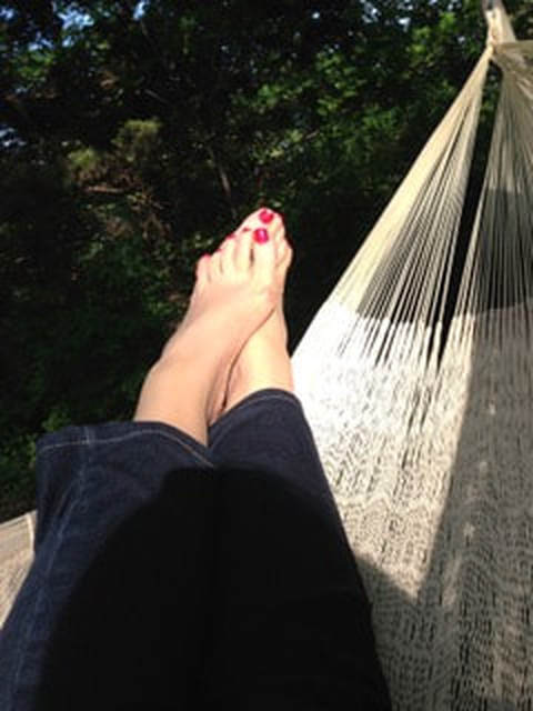 Bare feet in a hammock