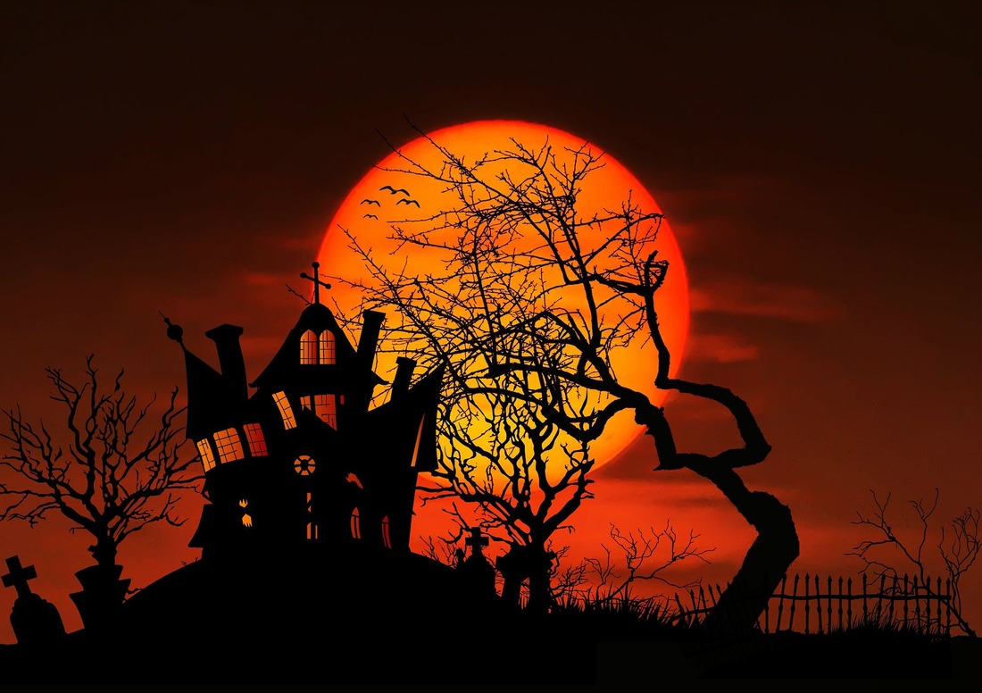 Scary house and tree in front of orange moon