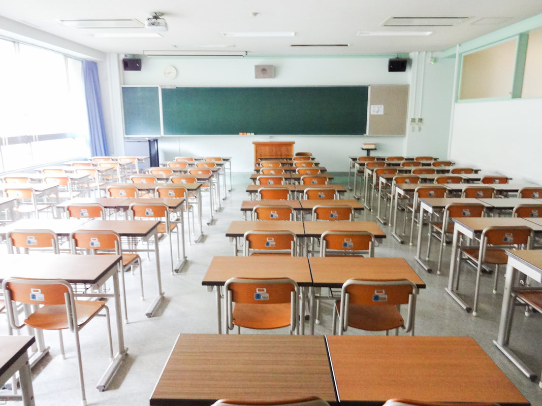 Rows of desks in empty classroom