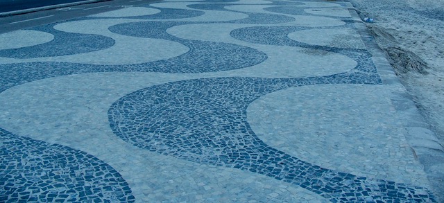Copacabana sidewalk made of mosaic tiles, black and white with sweeping curves